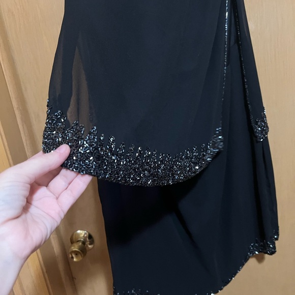 Elegant Black Sleeveless Dress with Embellished Neckline - Picture 4 of 5